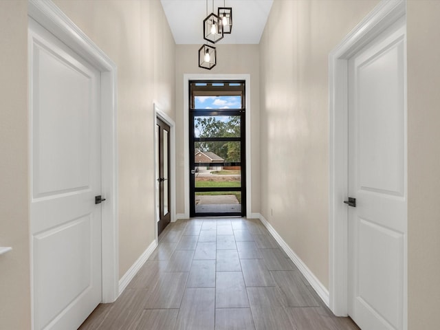 entryway featuring a notable chandelier