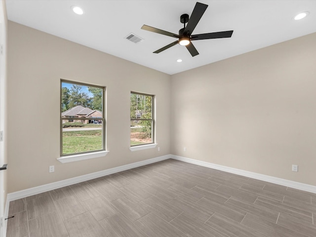 spare room with ceiling fan