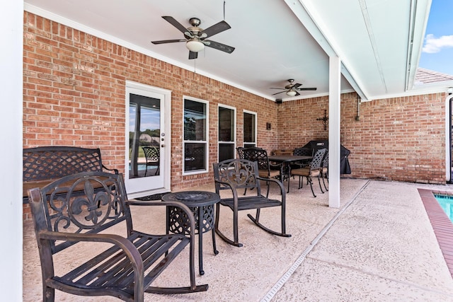 view of patio / terrace featuring ceiling fan