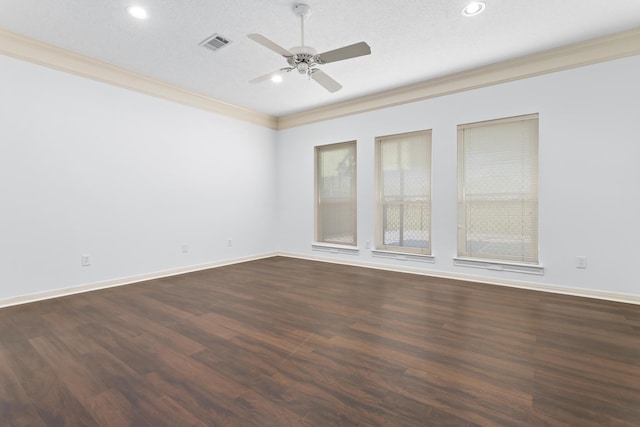 spare room featuring a textured ceiling, dark hardwood / wood-style floors, ceiling fan, and crown molding