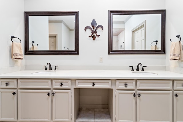 bathroom featuring tile patterned flooring and vanity