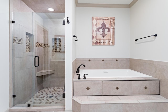 bathroom with independent shower and bath and ornamental molding