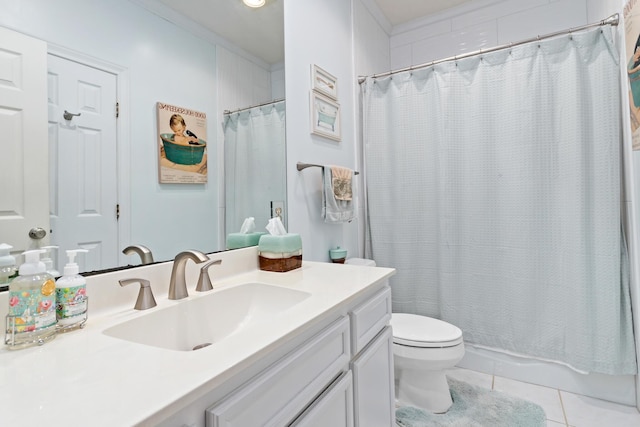 bathroom featuring toilet, vanity, tile patterned floors, and a shower with shower curtain