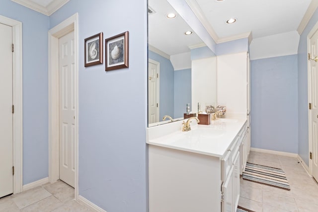 bathroom featuring tile patterned floors, vanity, and ornamental molding