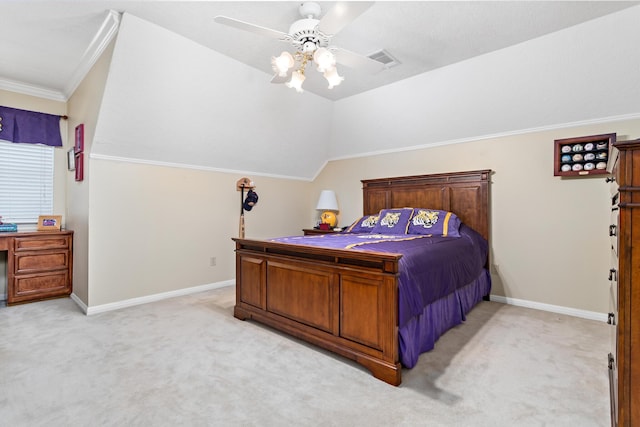 carpeted bedroom featuring ceiling fan, ornamental molding, and vaulted ceiling