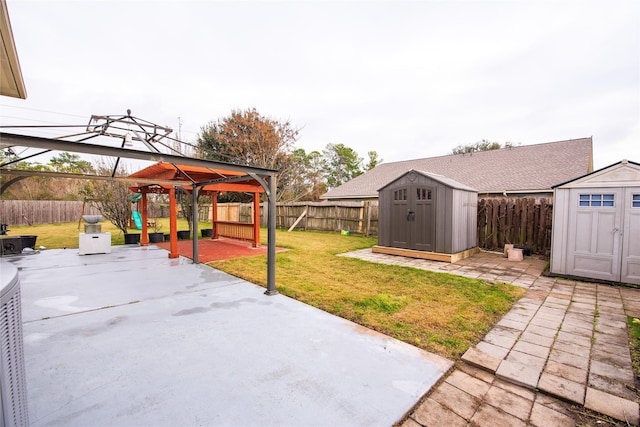 view of patio with a gazebo and a storage unit