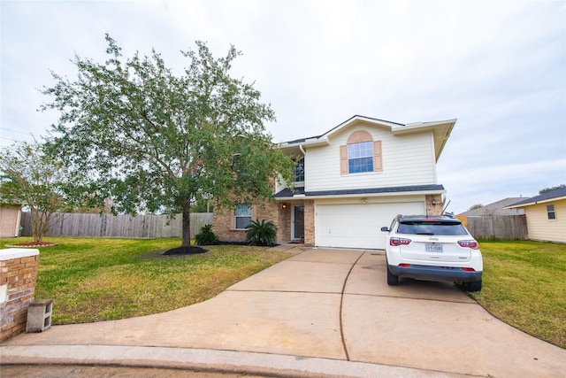 view of front of home with a front yard and a garage