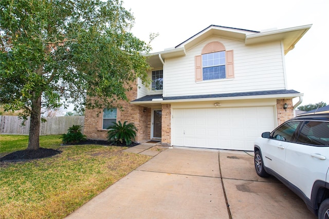 view of front of house featuring a front yard and a garage