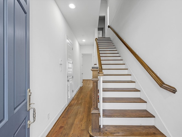 foyer entrance featuring dark hardwood / wood-style floors