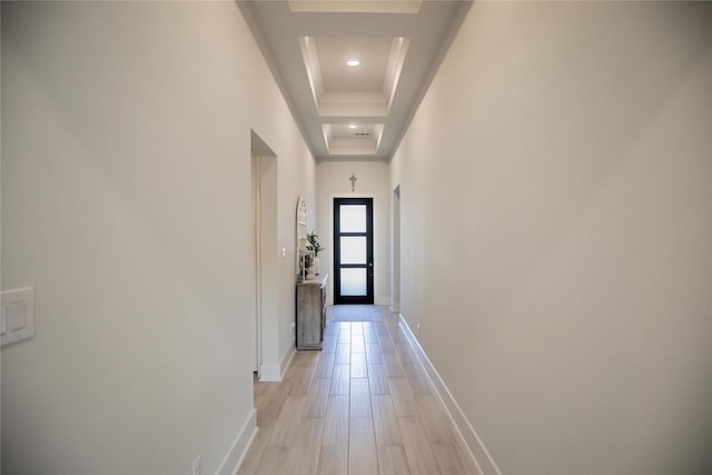 hallway with a tray ceiling