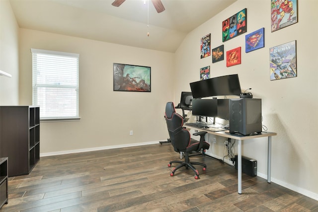 home office with dark hardwood / wood-style flooring, ceiling fan, and lofted ceiling