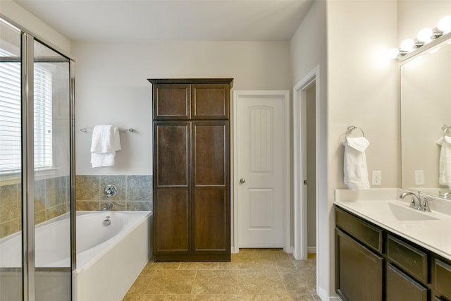 bathroom with a wealth of natural light, vanity, and plus walk in shower