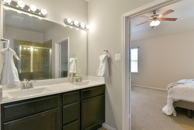 bathroom featuring an enclosed shower, vanity, and ceiling fan