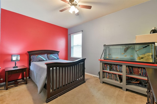 bedroom featuring light colored carpet and ceiling fan