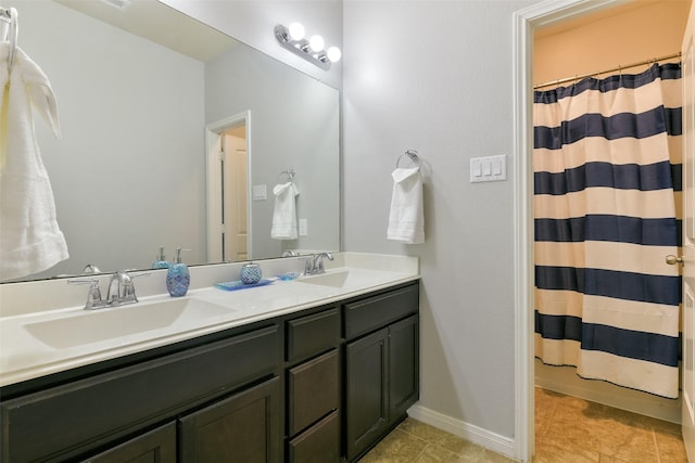 bathroom featuring a shower with curtain and vanity