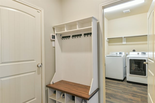 washroom featuring dark wood-type flooring and washer and dryer