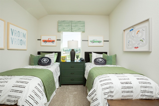 carpeted bedroom featuring lofted ceiling