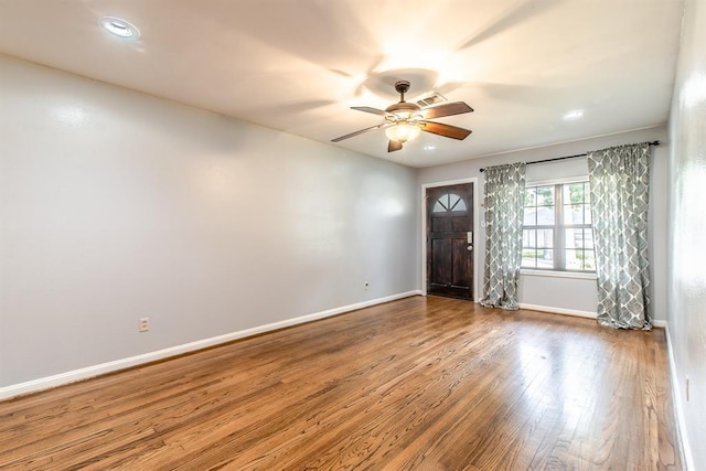 foyer with ceiling fan and hardwood / wood-style flooring