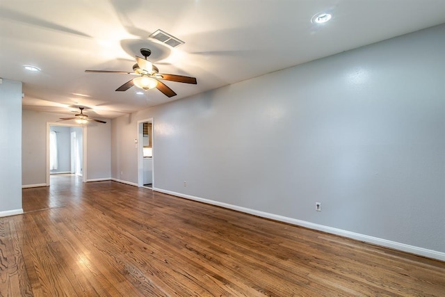 unfurnished room with ceiling fan and wood-type flooring