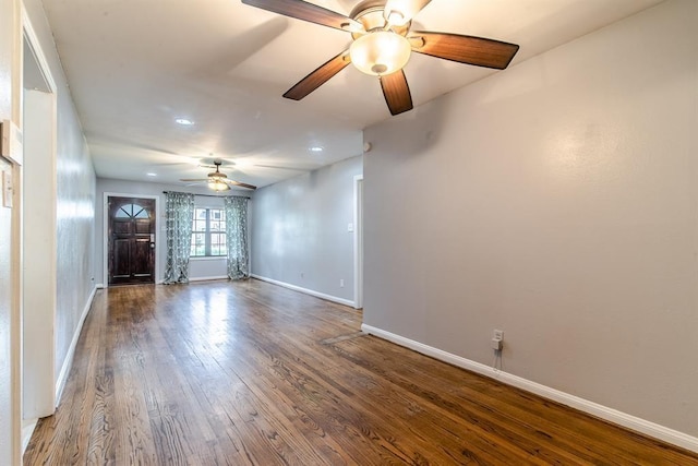 interior space with dark hardwood / wood-style floors and ceiling fan