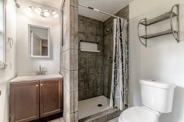 bathroom with curtained shower, vanity, a textured ceiling, and toilet