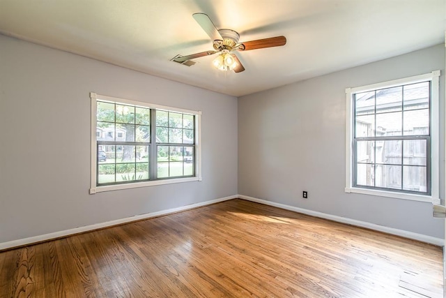 unfurnished room with ceiling fan and light hardwood / wood-style floors