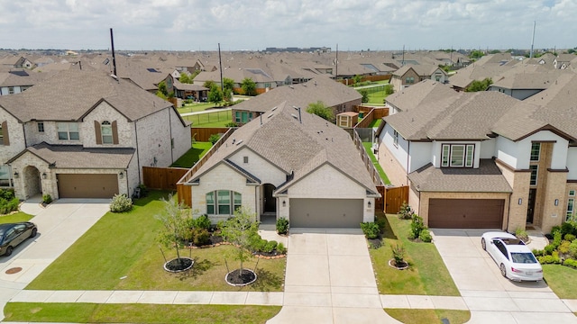 birds eye view of property with a residential view