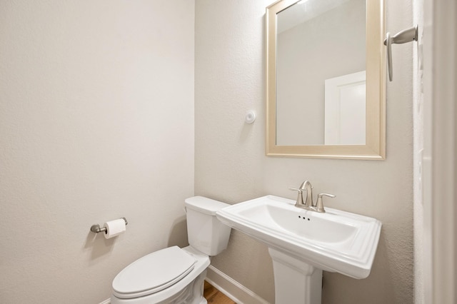 bathroom with sink and toilet