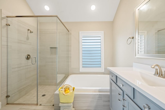 bathroom with vanity and separate shower and tub