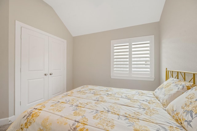 bedroom featuring a closet and vaulted ceiling