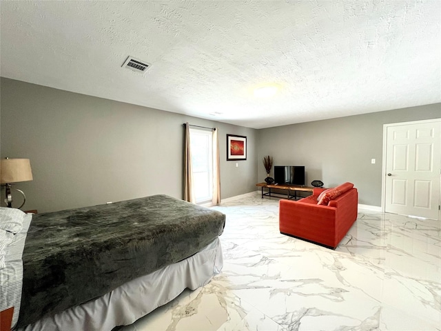 bedroom with a textured ceiling