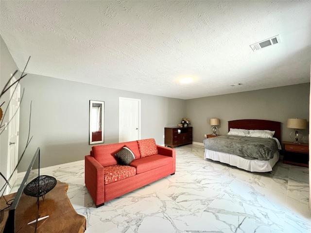 bedroom featuring a textured ceiling