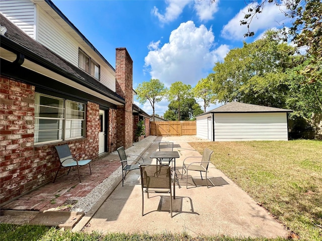 view of patio / terrace featuring an outdoor structure and a garage