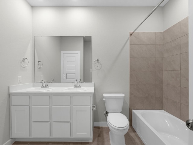 full bathroom featuring tile patterned floors, toilet, vanity, and shower / tub combination