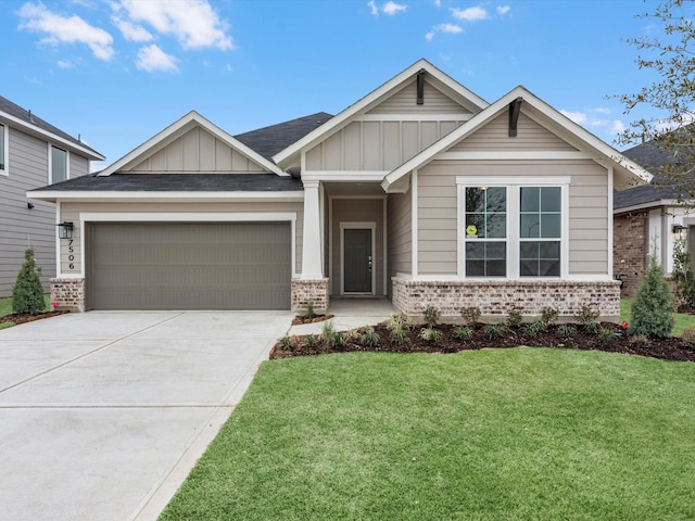 craftsman-style home with a garage and a front yard