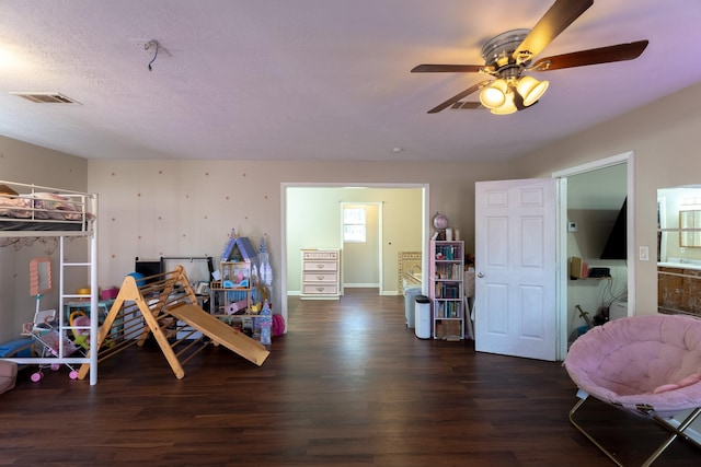 bedroom with ceiling fan and dark hardwood / wood-style flooring