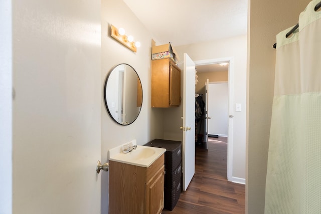 bathroom with vanity and hardwood / wood-style floors