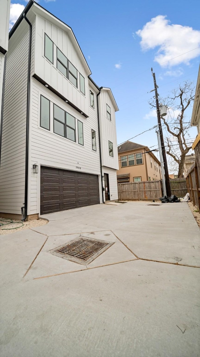 view of side of home with a garage