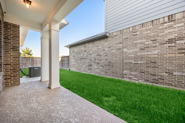 view of yard with a patio and central AC