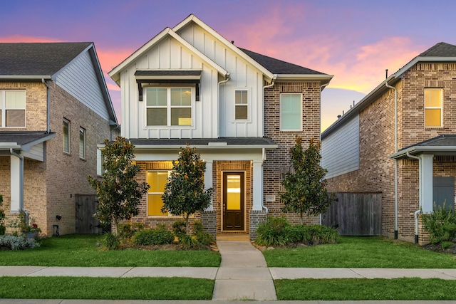 view of front of property with a yard