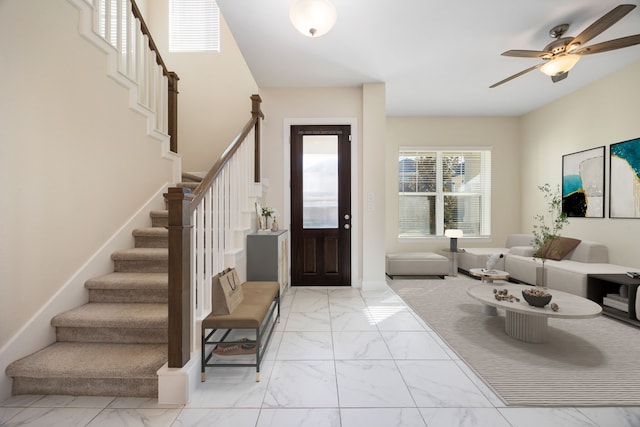 foyer featuring ceiling fan