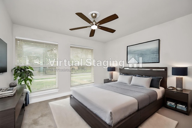 carpeted bedroom featuring ceiling fan