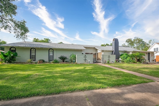 ranch-style house with a front lawn