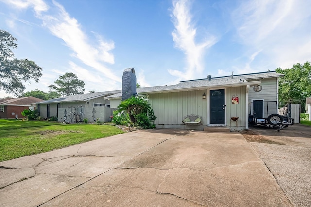 ranch-style house with a front lawn