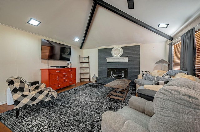 living room with vaulted ceiling with beams, wood-type flooring, and a fireplace