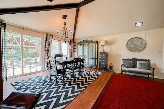 dining space featuring a notable chandelier, beam ceiling, and wood-type flooring