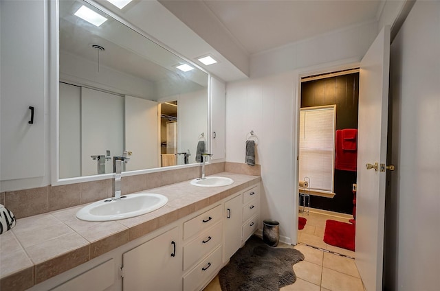 bathroom featuring tile patterned flooring and vanity