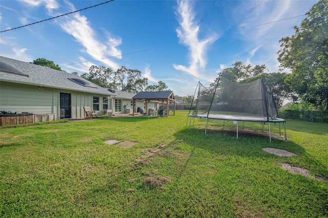 view of yard with a trampoline