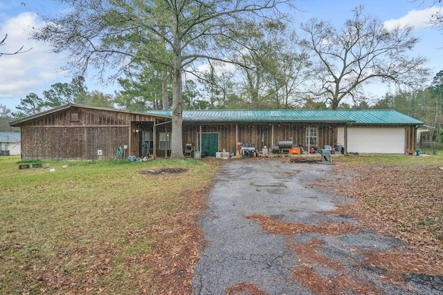 ranch-style house with a front lawn and a garage