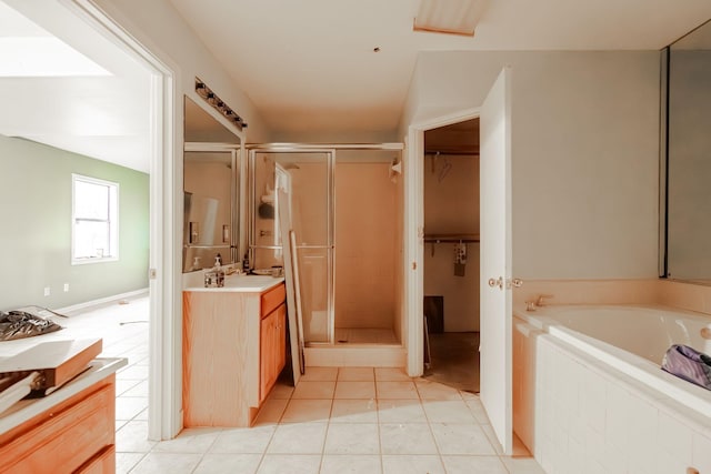 bathroom featuring tile patterned floors, vanity, and independent shower and bath